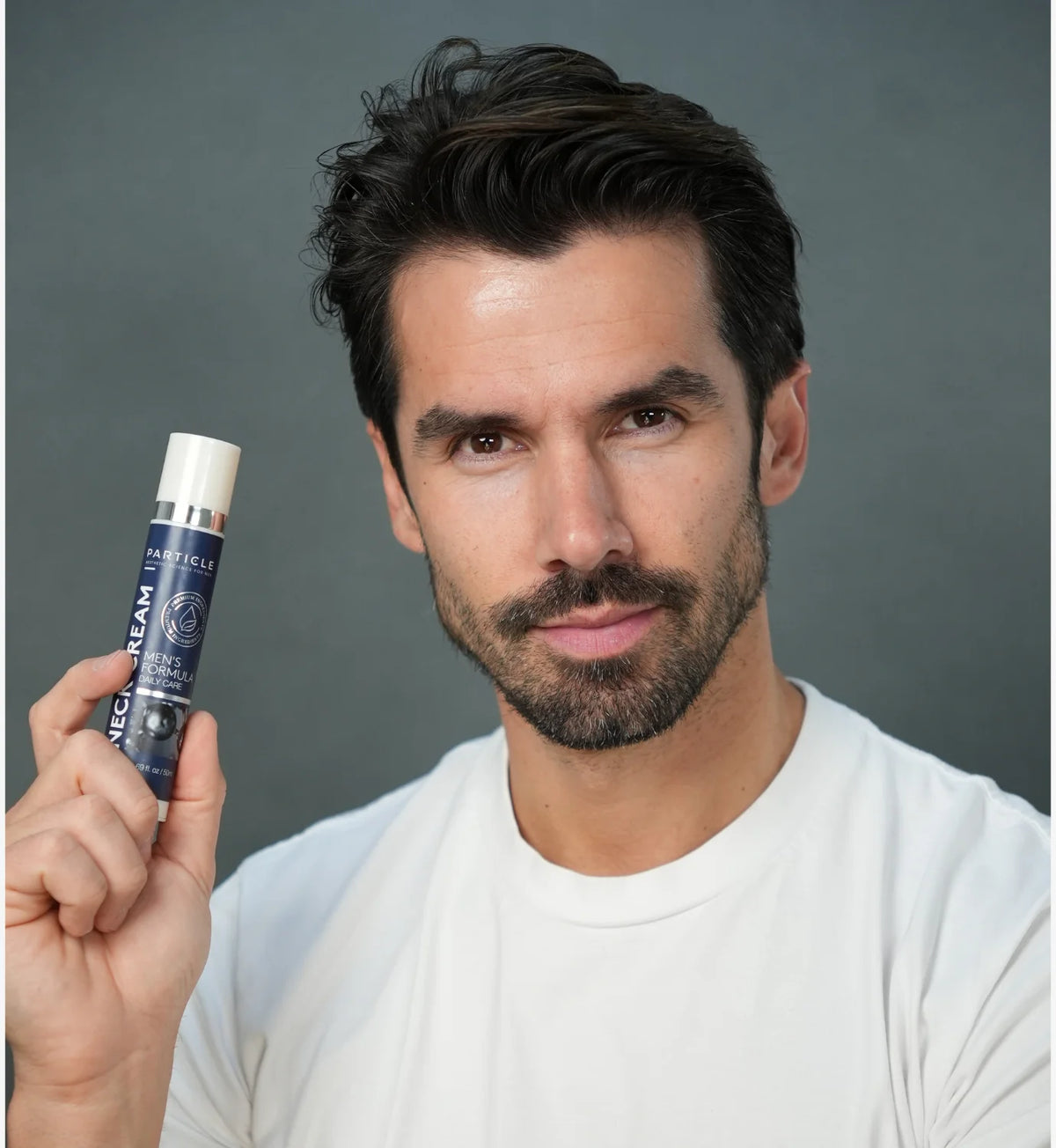 Man holding Particle Neck Cream
