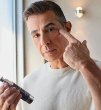 Man applying Particle Face Cream