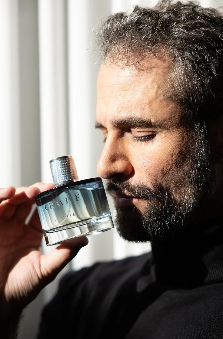 Man smelling Gravité men’s fragrance
