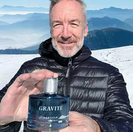 Clayton holding a Gravité fragrance bottle